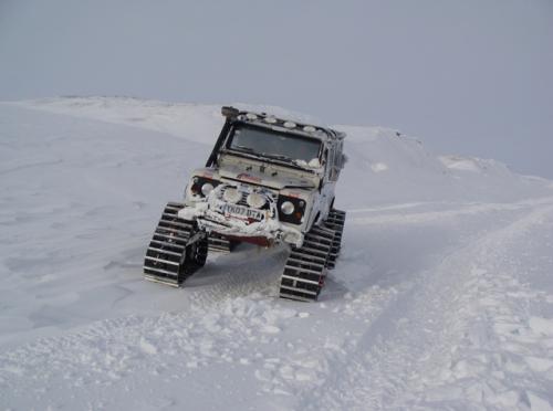 Tracked and Amphibious LWB land Rover driving on tracks on Cape to Cape special project