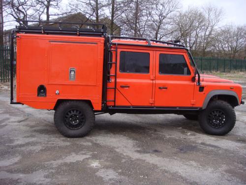 Special Project Land Rover Defender 130 with full roll cage, side ladders and roof rack