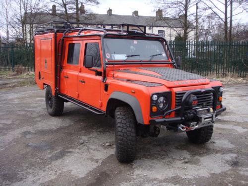 Special Project Land Rover Defender 130 with full roll cage, side ladders and roof rack