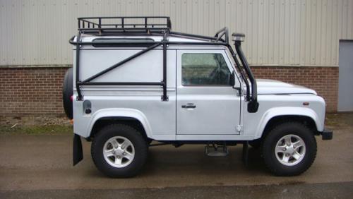 Land Rover Defender with external roll cage , roof rack and snorkel