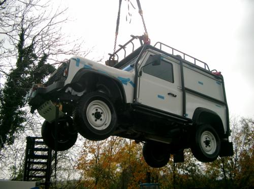 Helicopter lifting Land rover Defender